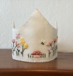 Hand embroidered crown. Perfect for any occasion!

The Crown is approx. 15 1/2" inches long with a 18" inches ribbon extension. Made from 100% wool felt (double layer), cotton lace ribbon, thread.

This crown is perfect for birthdays, seasonal celebrations, photo props, and creative play!

(Best fit for 3+ years) Waldorf Birthday Crown, Waldorf Crown, Diy Birthday Crown, Goose Birthday, Waldorf Birthday, Birthday Crowns, Crown Ideas, Birthday Hats, Felt Crown