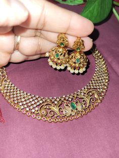 This set has 2 gorgeous earrings with Peacock design with White ,Red and Green Stones necklace unique design set. These Beautiful Gold Platted Necklace is Best for gifting and personal use, You can gift your  Mother, Sister ,Girlfriend, Relatives , Neighbors etc. Suitable for all Occasions. Best to wear on special occasions like Anniversary, Birthday, Diwali and other traditional functions. Ornate Kundan Necklace With Peacock Design For Wedding, Peacock Design Jewelry For Festivals, Ornate Peacock Design Necklace For Wedding, Festival Jewelry With Peacock Design, Ornate Peacock Design Necklace For Celebrations, Ornate Peacock Design Wedding Necklace, Temple Necklace With Peacock Design For Gift, Temple Necklace With Peacock Design As Gift, Gold Jewelry Sets With Peacock Design