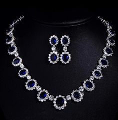 Channel timeless elegance with this Princess Diana-inspired Sapphire Necklace and Ring Set, part of our exquisite India Diamond Jewelry collection. The deep blue allure of the sapphire necklace perfectly complements the brilliance of American Diamonds in this bridal wedding set. Embrace sophistication and regal charm with this captivating ensemble. *𝐏𝐑𝐎𝐃𝐔𝐂𝐓 𝐃𝐄𝐓𝐀𝐈𝐋* * Material: Brass * Plating: White Rhodium Plated * Stone: AAA Quality CZ Diamond & Sapphire. *𝐃𝐈𝐌𝐄𝐍𝐒𝐈𝐎𝐍𝐒* *    Necklace- Weight: 32 gm, Length: 8.7 Inches, Drop Length: 4.5 Inches, Width: 0.7 Inches *    Earrings- Weight: 6 gm Each, Length: 1.65 Inches, Width: 0.65 Inches *𝐒𝐇𝐈𝐏𝐏𝐈𝐍𝐆 𝐏𝐎𝐋𝐈𝐂𝐘* * Shipping: worldwide from India. * Free shipping: All our products have a free standard shipping polic Blue Pear-shaped Sapphire Necklace, Blue Diamond Necklace With Jewels, Formal Sapphire Teardrop Jewelry, Blue Formal Jewelry With Stones, Formal Blue Jewelry With Stones, Formal Blue Stone Jewelry, Fine Jewelry Blue Jewelry Sets For Anniversary, Blue Fine Jewelry Sets For Anniversary, Party Sapphire Necklace With Sparkling Stones