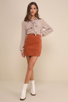 Keep it classic in the Lulus Katherina Rust Brown Button Front Corduroy Skirt! Soft and trendy corduroy shapes this high-waisted skirt with a flattering A-line silhouette and a row of functioning covered buttons along the side. Pair this skirt with a long sleeve top for a fall-approved look! Fit: This garment fits true to size. Length: Mid-thigh. Size medium measures 15.5" from waist to hem. Waist: Fitted - very fitted at natural waist. Hip: Loosely Fitted. Fabric: Fabric has no stretch. Unlined Corduroy Mini Skirt For Work, Corduroy Skirt For Fall Workwear, Fall Corduroy Skirt For Workwear, Trendy Button-up Mini Skirt For Fall, Chic Spring Corduroy Skirt, Spring Corduroy Mini Skirt With Button Closure, Fall Corduroy Mini Skirt With Button Closure, Fall Corduroy Button-up Bottoms, Corduroy Mini Skirt With Button Closure