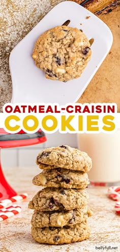 oatmeal raisin cookies stacked on top of each other in front of a glass of milk