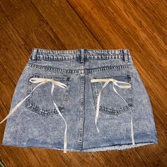 Never Worn Mini Skirt Denim Spring High Waist Dark Wash Skort, High Waist Dark Wash Skort For Spring, Blue Denim Skort For Summer, Denim Skirt Bottoms For Day Out, Denim Mini Skort For Spring, Spring Denim Mini Skort, Denim Mini Skirt For Spring, Denim Skort With Frayed Hem For Spring, High Rise Denim Skort For Day Out