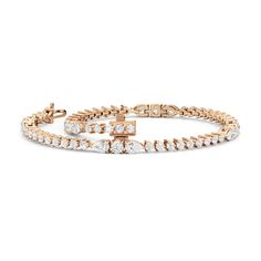 This lovely and lithe diamond bracelet is the perfect choice for someone who wants something a little bit out of the ordinary without veering too far away from tradition. It features a classic row of round diamonds interrupted by five stations that feature a larger round diamond flanked by pear diamonds. Dazzling Rose Gold Diamond Cut Bracelets, Dazzling Rose Gold Bracelets With Diamond Cut, Everyday Luxury Rose Gold Diamond Bracelet With Brilliant Cut, Rose Gold Cubic Zirconia Bracelets With Prong Setting, Everyday Luxury Rose Gold Cubic Zirconia Tennis Bracelet, Rose Gold Diamond Bracelet With Brilliant Cut, Classic Rose Gold Bracelet With Diamond Accents, Timeless Rose Gold Cubic Zirconia Diamond Bracelet, Rose Gold Brilliant Cut Diamond Bracelet