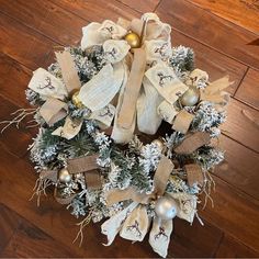 a christmas wreath on the floor with ornaments