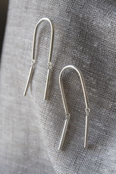 These minimalist articulated earrings boast gentle movement & bold beauty! -- d e t a i l s -- -the full length of earring measures roughly 7cm tall -each piece is hand forged & built from solid sterling silver -mirror finish -All Lola&Cash jewellery will arrive in gift giving mode! ---------------------------------------- Please Note - Made to order I require up to 2 weeks for manufacturing jewellery orders & send out email notifications once your order has been shipped. Shippin Modern Sterling Silver Long Drop Teardrop Earrings, Artisan Long Drop Sterling Silver Earrings, Artisan Silver Long Drop Earrings, Silver Long Drop Hand Forged Earrings, Handmade Sterling Silver Teardrop Linear Earrings, Articulated Earrings, Line Earrings, Gentle Movement, Silver Mirror