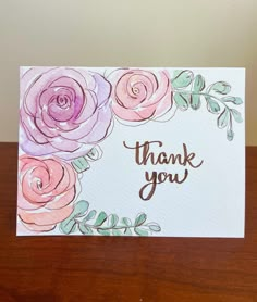 a thank card with watercolor flowers on it