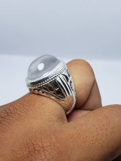 Natural beautiful Handmade Ring in 925 Sterling Silver Beautiful Design Customize able. Stone is Dur e Najaf which is most common Stone in Shia Community. Stone is 100% From Najaf. Oval shape Big Dur Al Najaf Stone Ring size 10 US Resize able Ring material is 925 Sterling Silver Pure Stone benefits! When a person wears a ring of this stone, at his every glance towards it, God gives him the reward of Ziarat, Haj and Umrah, which are kept in his record of action. The reward is equal to the reward Spiritual Silver Round Crystal Ring, Spiritual Silver Cabochon Rings, Silver Engraved Ring With Gemstone, Traditional White Gold Round Rings, Spiritual Silver Rings With Round Stone, Traditional Silver Rings With Gemstone, Traditional Silver Gemstone Rings, Traditional Silver Ring With Cabochon, Moon Stone Rings