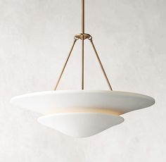 a white light hanging from a ceiling fixture