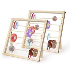 two wooden racks with different colored ribbons on them