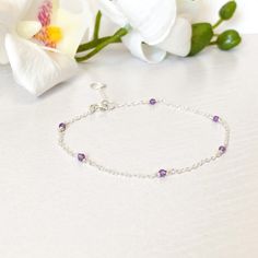 26.00 GBP This beautifully simple bracelet is lovingly handmade with a six tiny Amethyst gemstones and a choice of 14k Gold Filled, 14k Rose Gold Filled or Sterling Silver ​Chain. M A T E R I A L S: • Amethyst • 14k Gold Filled, 14k Rose Gold Filled or Sterling Silver Chain S I Z E: • Gemstones - Approximately 2-3mm • Chain Thickness - Approximately 1.1mm All of our jewellery is carefully handmade using good quality materials and handpicked gemstones, with the aim to produce quality pieces… Dainty Sterling Silver Bracelets With Natural Stones, Dainty Sterling Silver Crystal Gemstone Bracelet, Dainty Sterling Silver Gemstone Crystal Bracelet, Dainty Sterling Silver Bracelet For Anniversary, Delicate Amethyst Birthstone Jewelry, Dainty Sterling Silver Bracelet With Gemstone, Dainty Handmade Amethyst Bracelets, Adjustable Dainty Amethyst Bracelets, Dainty Amethyst Adjustable Bracelets