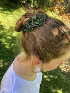 This is a medium sized hair comb with real malachite chip beads. It's very pretty and can be worn with almost any hairdo. This hair comb probably won't stay in if you wear it with your hair down, and I'm not sure how well it will work if you have short hair. This hair piece does have a plastic comb, which is helpful if you have metal allergies, and you can't see the plastic while you're wearing it anyways. The wire is brass, so it's not quite gold in color, but still looks nice. Elven Hair, Elven Hairstyles, Floral Hair Comb, Floral Hair Combs, Hair Comb Bridal, Bridal Comb, Floral Spray, Have Metal, Hair Down