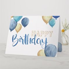 a birthday card with watercolor balloons and the words happy birthday written in blue ink