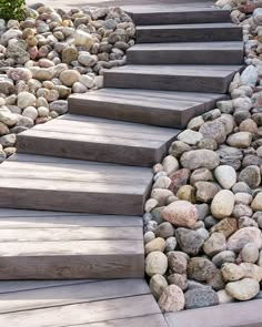 the steps are lined with rocks and grass