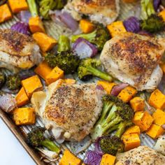 chicken, broccoli and sweet potatoes on a baking sheet