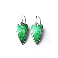 Glass Enamel earrings made by fusing coloured glass over fine silver. The silver has an etched texture, which is visible through the transparent glass. This technique is known as Basse-taille. The colours are shades of green, with some yellow-green details, a very subtle colour shift. There is counter enamel on the other side. These are one of a kind!  Enamel is quite hard to photograph, as the colours change so much according to the light. The pictures were taken outside in natural daylight. Th Modern Hand Painted Green Jewelry, Hand Painted Green Modern Jewelry, Modern Green Enamel Jewelry, Green Teardrop Enamel Jewelry, Green Hand Painted Sterling Silver Earrings, Green Enamel Earrings With Artistic Design, Artistic Green Sterling Silver Earrings, Artisan Green Enamel Earrings, Vintage Green Enamel Earrings