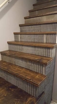 an old set of stairs made out of tin canisters with wood treading