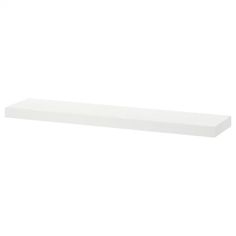 a white shelf that is sitting on the wall in front of a white background with no people