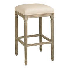 the backless stool is made from wood and has a beige upholstered seat