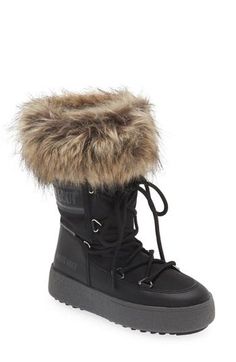 A water-repellent winter boot featuring fluffy faux-fur trim brings out futuristic vibes while a rubber sole is ready to trek through the city and mountains. Removable insole Lace-up style Water-repellent Textile, synthetic and synthetic faux-fur upper/textile lining/rubber sole Imported Moon Boot, Moon Boots, Fur Trim, Up Styles, Winter Boot, Repellent, Girls Shoes, Water Repellent, Monaco