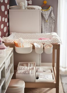 an organized baby changing table in a nursery