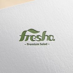 the fresho logo is displayed on a white paper with green lettering and a leaf