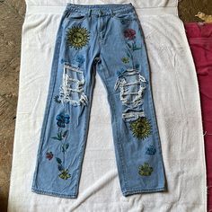 Blue, Brand New, Never Worn With Floral Print And Rips 85% Cotton, 15% Polyester Blue Floral Print Jeans For Summer, Casual Blue Jeans For Spring, Blue Denim Jeans With Floral Print, Trendy Blue Jeans With Floral Print, Trendy Blue Jeans With Floral Embroidery, Spring Vacation Denim Jeans, Blue Cotton Jeans For Spring, Summer Blue Jeans With Floral Embroidery, Blue Jeans With Floral Embroidery For Summer