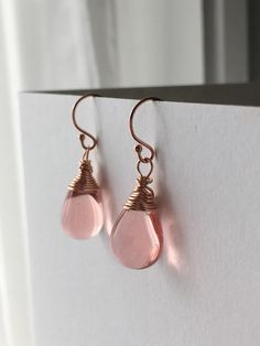 Blush pink teardrop briolettes have been have been lovingly hand wrapped in rose gold filled wire.  The soft warm blush rose pink colour compliments the rose gold beautifully, to create a gorgeous pair of earrings. I've used the 9 x 13 mm sized Czech glass teardrop briolettes to handcraft these earrings. You can choose which type of ear fitting you would like from the drop down menu. Please note the last photograph shows the 3mm ball headed stud fittings which are now also available in 4mm. So w Bridal Dangle Earrings, Red Bead Earrings, Briolette Earrings, Rose Gold Drop Earrings, Blush Earrings, Morganite Earrings, Rose Gold Brown, Brown Earrings, Bridal Earrings Drop