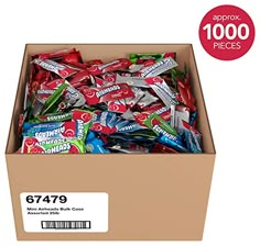 a box filled with lots of candy sitting on top of a table