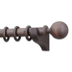 the curtain rod is made out of wood and has round knobs on each end