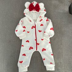 Never Worn. Great Condition. Hood Has Fuzzy Bear Ears And Red Bow. Has Red Zipper And Read Hearts All Over. Size 70 Which Is 9-12 Mos Red Long Sleeve Onesie For Playwear, Red Long Sleeve Onesie For Play, Cute White Hooded Onesie, Cute Hooded Onesie For Playtime, White Cotton Hooded Onesie, Cute White Onesie For Winter, Red Winter Onesie For Playtime, Red Onesie For Playtime In Winter, Cute White Winter Onesie