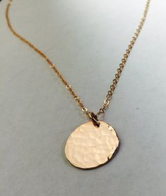 This listing is for a 14K gold filled, 14K rose gold filled, or sterling silver disc pendant and chain. -Delicate, high-quality 14k gold filled, 14k rose gold filled, or sterling silver disc pendant and chain.-This is a medium sized disc and is 15mm.-Choose either hand hammered as shown or smooth finish for the disc. This item will be delivered in a gift box ready for gift giving. Everyday Rose Gold Medallion Jewelry, Rose Gold Charm Necklace With Round 14k Gold Pendant, Rose Gold 14k Gold Charm Necklace With Round Pendant, Rose Gold 14k Gold Round Pendant Charm Necklace, Tarnish Resistant Rose Gold Medallion Jewelry, Dainty Rose Gold Medallion Jewelry, Tarnish-resistant Rose Gold Medallion Jewelry, Minimalist Rose Gold Medallion Jewelry, Rose Gold Round Disc Jewelry, Tarnish Resistant