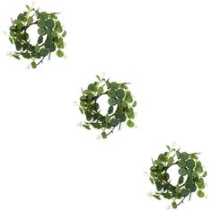 three green wreaths with white flowers on them