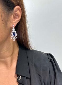 For Sale on 1stDibs - The Following Item we are offering is a Rare Important Radiant 18KT Gold Large Rare Fancy Blue Ceylon Sapphire and Diamond Earrings. Earrings are comprised Luxury Blue Pear-shaped Earrings, Luxury Pierced Chandelier Earrings For Formal Events, Elegant Sapphire Drop Jewelry, Elegant Blue Round Diamond Earrings, Luxury Blue Drop Earrings, Elegant Sapphire Dangle Jewelry, Elegant Sapphire Diamond Earrings With Accents, Elegant Pear-shaped Chandelier Earrings For Formal Occasions, Formal Pear-shaped Chandelier Earrings