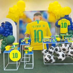 a soccer themed birthday party with balloons and decorations