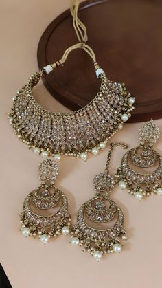 Heavy Bridal wedding golden Polki necklace set With mangtika Bridal Jewelry, Indian Pakistani wedding Jewelry, Polki bridal necklace Easy to wear, Light in weight & gives you a classy Look. It can be wear in festival occasion with matching salwar or saree. The fish hook is also attached at the top of earring for smooth wear and removal of earrings. GIFT FOR HER , A perfect Valentine Gifts for Girlfriend / Wife or indulge yourself with these beauties. Material: Gold Plated Necklaces Set For : Women and Girls Women love jewelry; specially artificial jewelry adore a women, They wear it on different occasion, They have special importance on ring ceremony, wedding and festive time, They can also wear it on regular basis , Make your moment memorable with this range, This jewelry features a uniqu Mangtika Bridal, Pakistani Jewelry Bridal, Pakistani Wedding Jewelry, Bridal Jewelry Indian, Polki Necklace Set, Ring Ceremony, Artificial Jewelry, Rings Ceremony, Necklaces Set