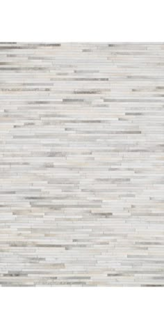 a white and grey wall with wood planks