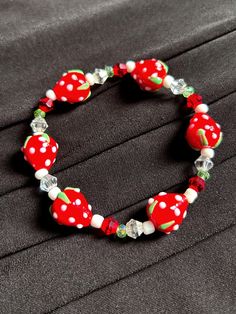 New to our jewel box is this cute and sweet strawberry glass bead bracelet. If you love fruits this is the perfect bracelet to add to your arm candy. Details -Bracelet Material: Glass -Bracelet Opening: Stretch Elastic Cute Red Stretch Bracelet As Gift, Cute Red Stretch Bracelet Gift, Sweet Adjustable Beaded Bracelets With Round Beads, Cute Red Beaded Bracelets With Round Beads, Adjustable Sweet Style Beaded Bracelets With Round Beads, Casual Glass Bracelets As Gift, Cute Red Beaded Bracelets, Cute Red Beaded Bracelets With Heart Beads, Cute Red Beaded Bracelet