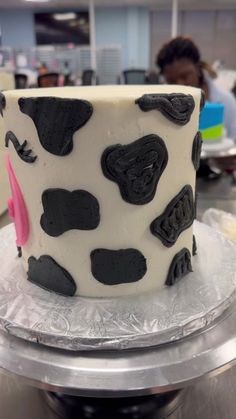 a cake with black and white designs on it