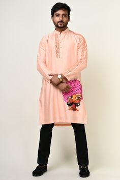 An all season style, the mirror work kurta is crafted in silk fabric and graced with delicate hand painting that is ideal for festivities and weddings. Components : 1 Fabric : Silk Neckline : Mandarin collar Hand Work : Mirror Work Other Details : Hand Painting with additional sequence detailing on it  Color : Peach Traditional Silk Kurta With Mirror Work, Festive Silk Kurta With Mirror Work, Festival Cotton Silk Sherwani With Mirror Work, Eid Art Silk Kurta With Mirror Work, Diwali Kurta With Mirror Work For Puja, Chanderi Kurta With Mirror Work For Puja, Silk Kurta With Resham Embroidery For Puja, Silk Straight Kurta For Puja, Silk Kurta For Puja During Navratri