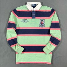 Polo Ralph Lauren Striped Rugby Shirt Details - Brand New With Tags - Sizes : Medium, Large Available. Xl Sold Out - Colors : Green / Navy Blue / Salmon - Collegiate Logo Patch Top Left Chest - “Rl 3 Eastern Division” Embroidered Top Left Chest - 100% Cotton - Fit : Classic - Quarter Top Quilt Stitching Shipping - Item Will Be Shipped The Same Day Of Purchase Or The Very Next Business Day. Tracking Included. Fully Insured Preppy Striped Polo Collar Top, Blue Long Sleeve Shirt With Striped Collar, Multicolor Cotton Top With Striped Collar, Classic Blue College Tops, Classic Blue Top For Everyday Wear, Classic Multicolor Long Sleeve Tops, Green Cotton Shirt With Striped Collar, Blue Cotton Top With Striped Collar, Preppy Green Cotton Top