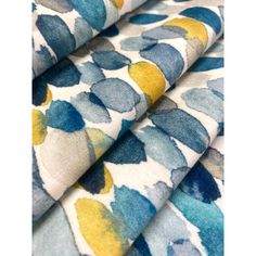 blue and yellow fabric with circles on it