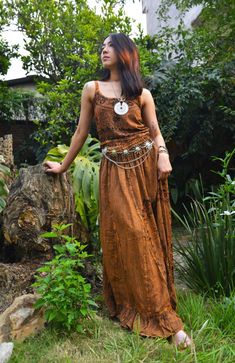 Introducing our Pari Vintage Vibe Brown Top & Maxi Skirt, perfect for embracing boho hippie vibes! This stunning set includes a maxi skirt with a pleated border that adds a touch of elegance and offers a chic, comfortable fit. Crafted with comfort yet elegant fashion in mind, this ensemble is ideal for creating enchanting looks. Choose between two top variations: a halter top or a smocked top, both designed to complement the flowing silhouette of the skirt. Available in various sizes, this set c Brown Boho Maxi Dress In Hippie Style, Brown Boho Maxi Dress Hippie Style, Brown Hippie Boho Maxi Dress, Brown Hippie Maxi Dress For Festival, Festival Flowy Tiered Maxi Dress, Bohemian Floor-length Flowy Maxi Dress, Hippie Boho Print Maxi Skirt For Vacation, Hippie Flowy Boho Print Maxi Skirt, Hippie Flowy Maxi Dress