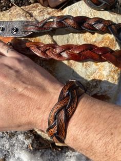 Measures 1 1/4" Wide, will fit any wrist up to 9" Around. Adjustable Western Leather Bracelet For Festivals, Hand Tooled Adjustable Leather Bracelets, Brown Hand Tooled Western Bracelets, Western Style Brown Cuff Bracelet For Festivals, Hand Tooled Leather Bracelets For Festivals, Adjustable Hand Tooled Leather Bracelet, Adjustable Western Leather Bracelet, Western Style Hand Tooled Leather Bracelets, Rustic Hand Tooled Festival Bracelets