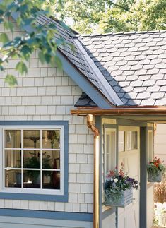 a white house with blue trim and windows