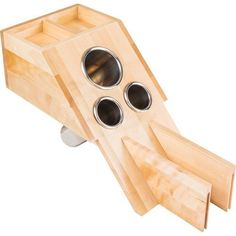 a wooden object with three holes in it