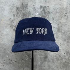 New York Embroidered Corduroy Hat. 100% cotton corduroy Soft, unstructured crown with a cotton twill sweatband and taping. Adjustable buckle. This product is made especially for you as soon as you place an order, which is why it takes us a bit longer to deliver it to you. Making products on demand instead of in bulk helps reduce overproduction, so thank you for making thoughtful purchasing decisions! Cotton Snapback Hat With Embroidered Logo Short Brim, Cotton Trucker Hat With Short Brim For Streetwear, Casual Corduroy Dad Hat With Flat Bill, Casual Corduroy Baseball Cap With Flat Brim, Cotton Snapback Hat With Short Brim For Streetwear, Cotton Short Brim Trucker Hat For Streetwear, Casual Corduroy Snapback Dad Hat, Casual Corduroy Snapback Hat For Streetwear, Corduroy Hat With Curved Brim For Streetwear