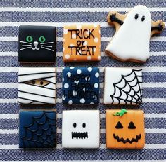 decorated cookies are arranged in the shape of halloween treats