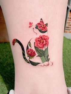 a cat with flowers on the side of its leg