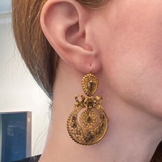 "These earrings are beyond exquisite, BEYOND. I encourage you to zoom way in on the pics and look at the absolutely incredible metal work on these beauties, it is phenomenal. Made circa 1850, very possibly earlier, these earrings are done in the pendeloque style popularized in the mid-1700's. Bezel set foil-backed citrines sit atop hand sawn scrolling metalwork that is full of fine detail. And as if things couldn't get any better, these are also day/night! And they're not just day/night with two Antique Earrings With Historical Design, Antique Gold Earrings With Historical Design, Victorian Style Ceremonial Dangle Earrings, Victorian Gold Plug Earrings, Historical Yellow Gold Drop Earrings, Victorian Style Ceremonial Earrings For Pierced Ears, Yellow Gold Historical Drop Earrings, Yellow Gold Drop Earrings With Historical Design, Gold Earrings With Historical Design For Wedding