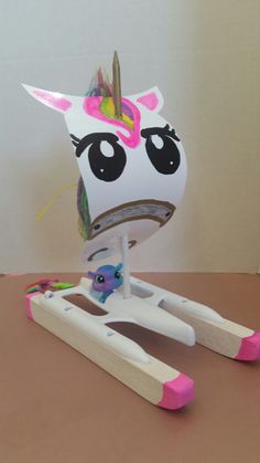 a paper toy that looks like a unicorn